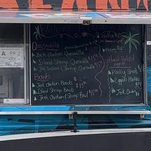 a menu on the side of the truck