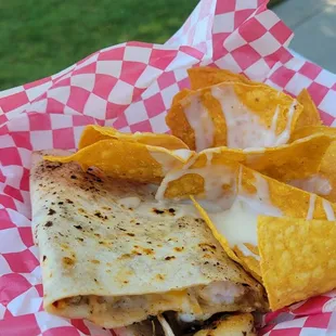 a quesadilla and chips