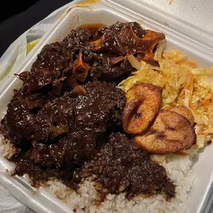 Oxtails, white rice , cabbage, plantains
