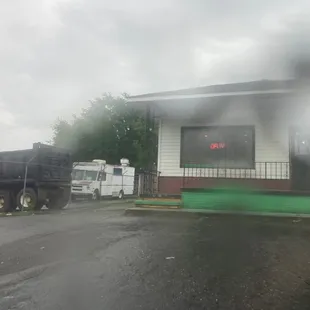 a truck parked in front of a building