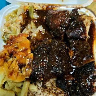 Jerk chicken Jumbo meal - chicken had great islandy flavor, but rice &amp; peas were bland, cabbage tasted off, and mac n cheese was dry