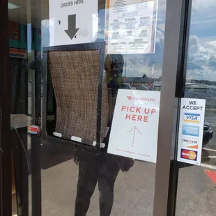 Taking orders through the door.