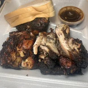 Jerk Chicken Jerk Chicken (Lb) with fresh baked bread.