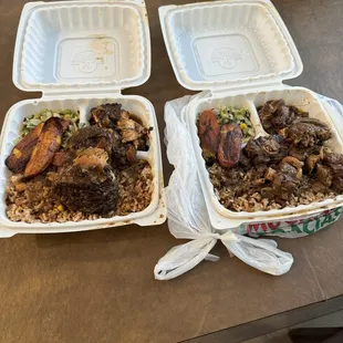 Small jerk chicken and small oxtail both with rice&amp;beans, plantains and veggie mix.