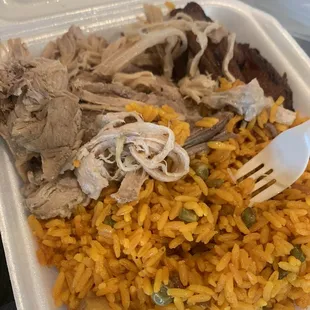 Pernil Plate with yellow fried rice and platanos