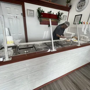 a man preparing food in a restaurant
