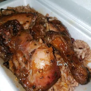 Close up of the Jerk chicken and rice and peas