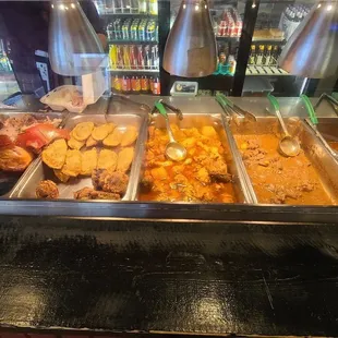 Empanadas, beef stew, chicken, pork leg, beans