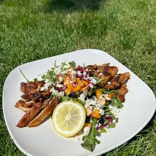 Caribe Salad:        
Arugula, red cabbage, toasted almond, dried cranberries, sliced mango, queso fresco, cilantro crema  add chicken.