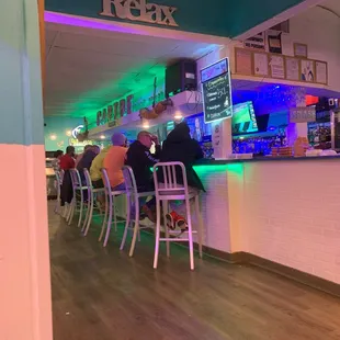 people sitting at a bar