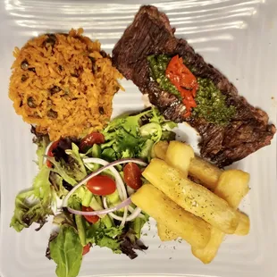 Churrasco (skirt steak) platter with yuca fries, arroz con gandules &amp; home made chimichurri.