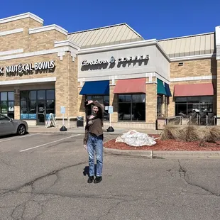 a man walking in a parking lot