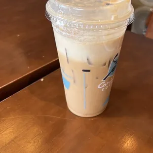 a plastic cup on a wooden table