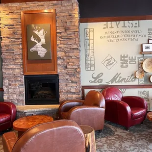 a coffee shop with leather chairs