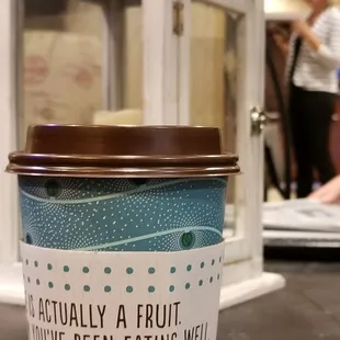 a cup of coffee on a table