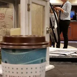 a coffee cup with a message on it