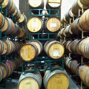 rows of barrels in a wine cellar