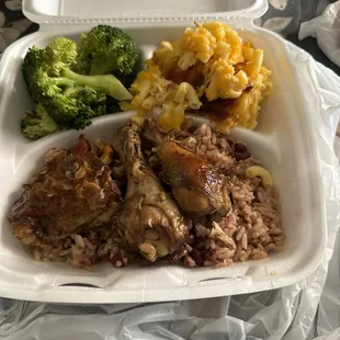 Jerk chicken, red beans and rice, steamed broccoli and macaroni and cheese