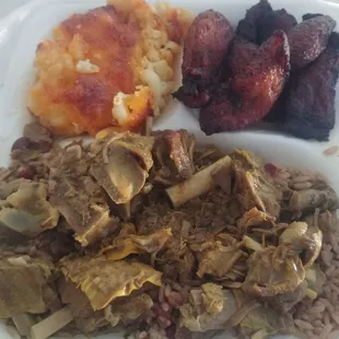 Red beans and rice with stewed  goat, macaroni and  cheese, and fried plantains for only $17 (this is the large plate)
