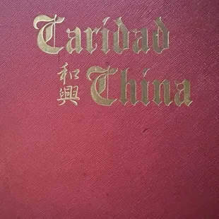 a close up of a red book
