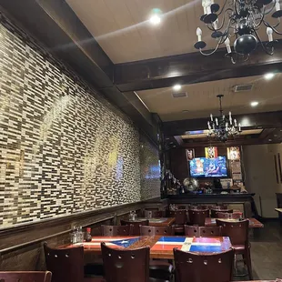 a dining area with a chandelier