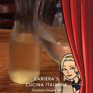 a glass of wine and a pitcher