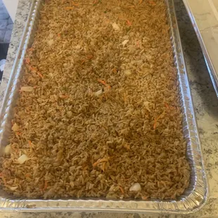 a pan of rice and carrots