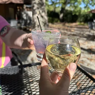 a person holding a glass of wine