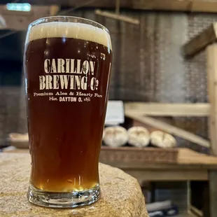 a pint of beer on a table