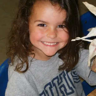 Corn husking, counting, and eventually painting with corn husks and cobs.