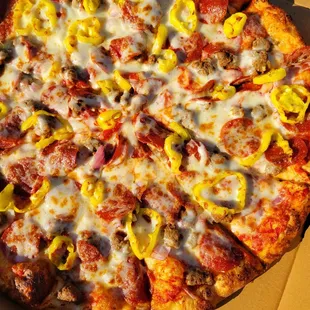 Sausage, pepperoni, onions and banana peppers