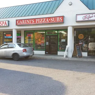 a car parked in front of the store