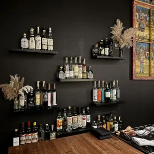 a bar with liquor bottles on shelves