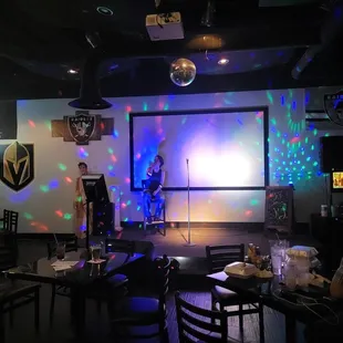My wife, singing on the stage.