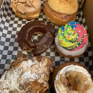 Almond Croissant, banana cream pie, rainbow filled, chocolate old fashioned Cinnamon Toast Crunch filled, creme brûlée sticky bun