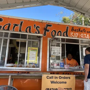 a man standing in front of a food truck