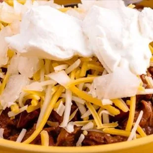 a bowl of chili and cheese