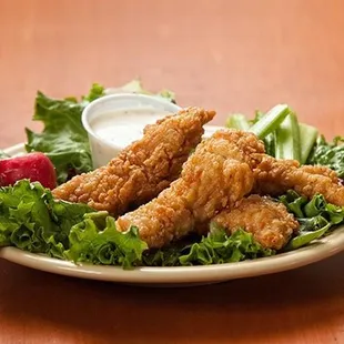 a plate of fried chicken strips
