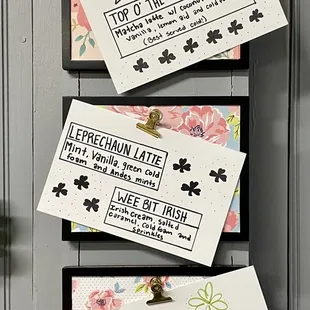 a bunch of cards hanging on a wall