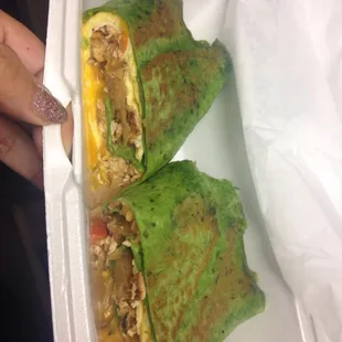 Spinach Wrap with egg, cheese, grilled chicken, tomatoes, mushrooms, and grilled onion. DBOMB.COM