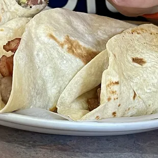 Plate of 4 (well, 3 and a half at this point) full tacos- carne guisada, Bean and bacon, Country sausage and egg.