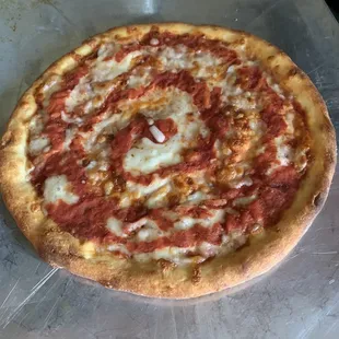 a pizza with pepperoni and cheese