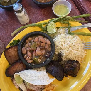 Burned and dry carnitas with &quot;guacamole&quot; in a tiny container