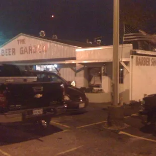 Carlos&apos;s Beer Garden &amp; Barber Shop at night