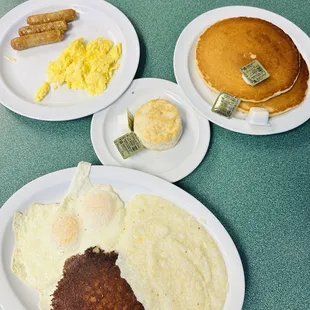 2 eggs with cornbeef hash, grits and biscuit Pancakes with eggs and sausage