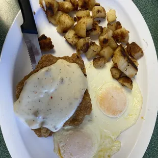 Home fries, eggs over easy, beef fritter with gravy