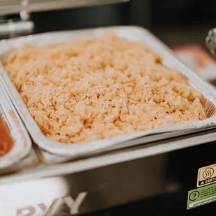 three trays of rice and beans