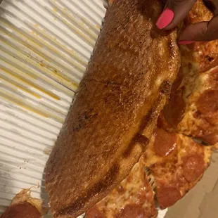 Crust too dark and hard . Too much grease