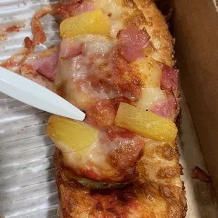 a slice of pizza in a box