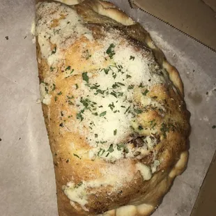 Super cheesy calzone add any topping like a pizza feeds one really hungry person